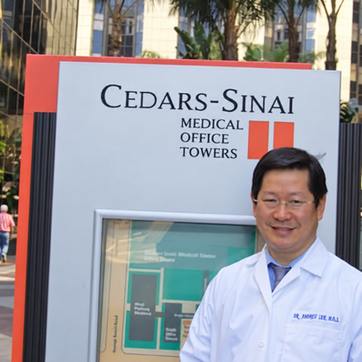 Andre Lee, DDS, wearing his white coat